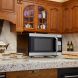 Hamilton Beach (EM145AAK-P) 1.6 Cu. Ft. Digital Microwave Oven - 1