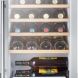Summit Appliance SCR312LWC2 17 Wine Cellar with 22 Bottle Capacity Factory Installed Lock Professional Handle Wooden Shelving Interior LED Light and Automatic Defrost: Stainless Steel with Black Cabinet - 1